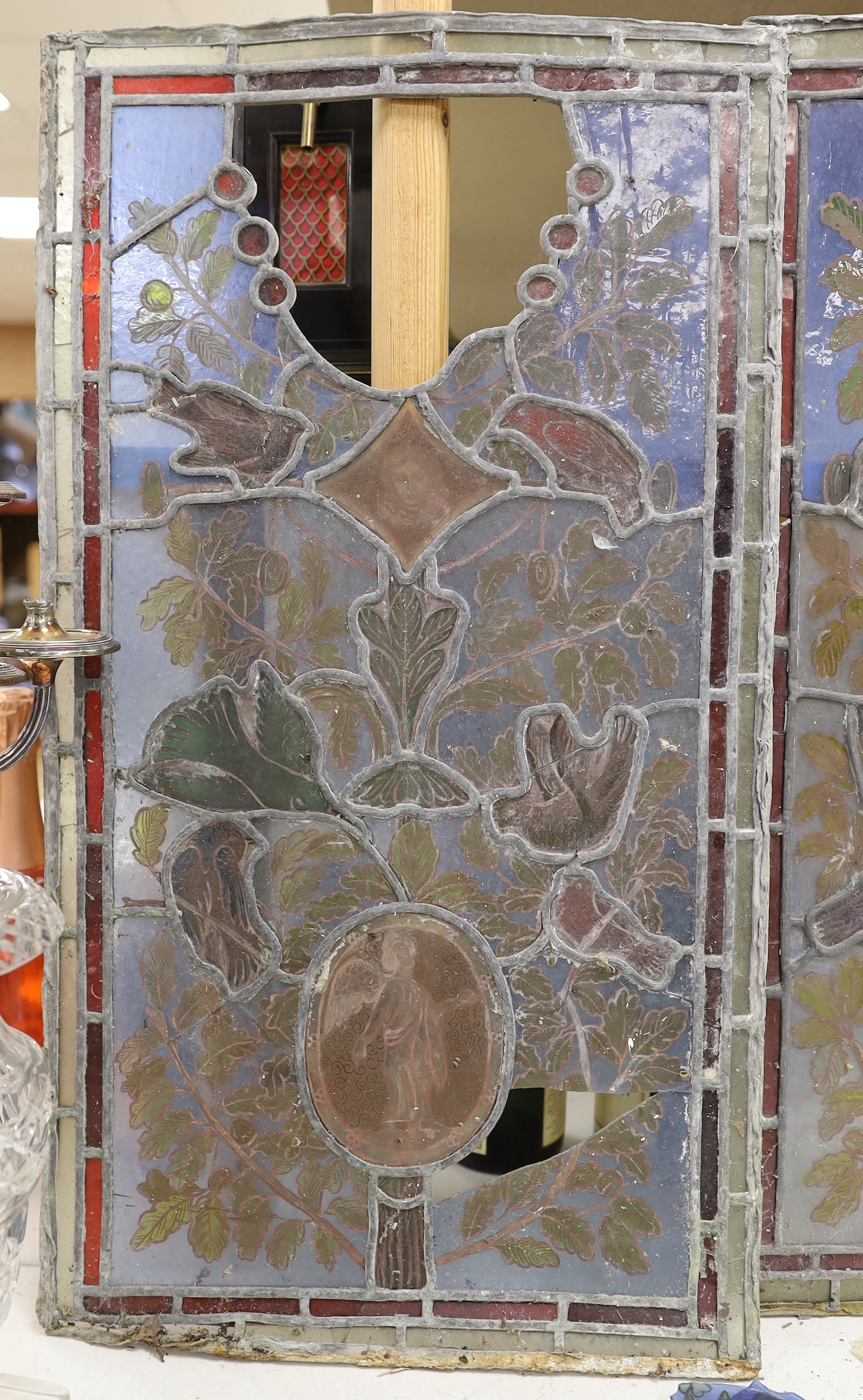 Three stained glass panels of birds and foliage, 71cm high, 39cm wide (a.f.)